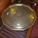 A large brass Islamic tray with incised