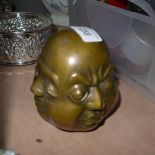 A bronzed four faced Buddha head