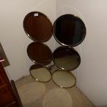 A modern circular section wall mirror