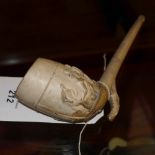 An unusual C19th clay pipe depicting a f