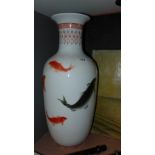 A pair of ceramic vases with fish decora