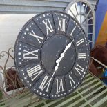 A distressed garden wall clock with Roma