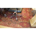 A Persian type carpet the red ground with allover stylized motifs in single border