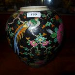 A Japanese famille rose ginger jar, with floral and Phoenix detailing on a black ground. height 24cm