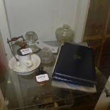 A collection of silver coins, glass metal strike, inkwell, perfume bottle and a collection of