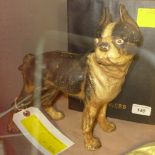 An antique bronzed dog door stop/coin holder