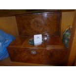 A Regency burr elm tea caddy with hinged lid containing lidded compartments and mixing bowl with