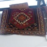 A fine old South West Persian Lori rug bearing triple pole medallion on a terracotta field guarded