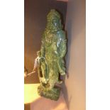 A carved simulated jade figure