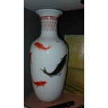 A pair of ceramic vases with fish decoration