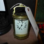 A late C19th French oval carriage clock in working order with key