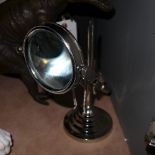 A pair of chromium magnifying glass on stands