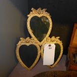 A gilted triple heart framed dressing mirror