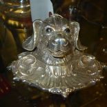 A silver plated inkwell in the form of a dog