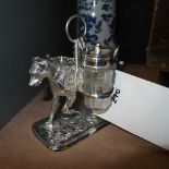 A silver plated cruet on dog stand