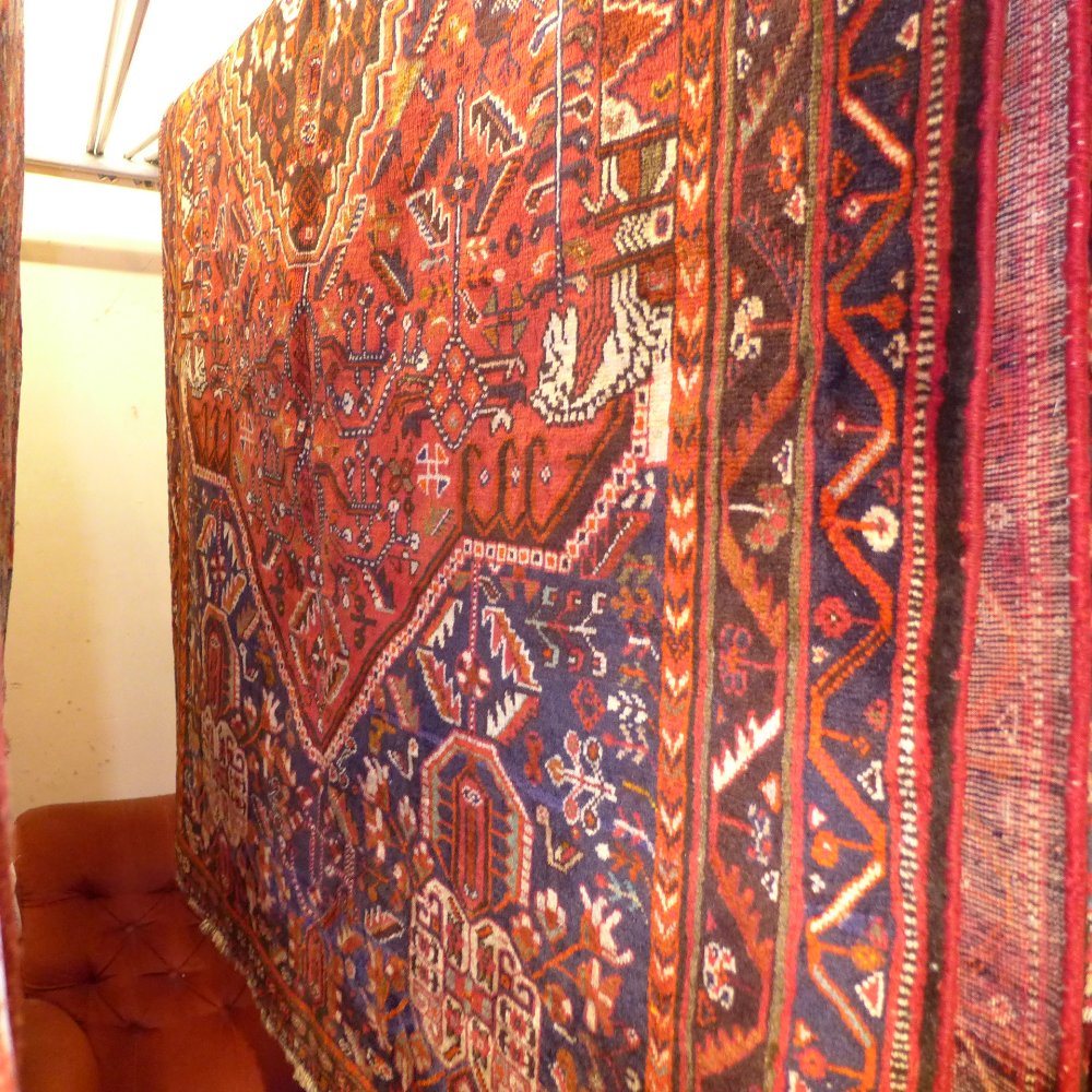 A fine South West Persian Qashgai rug 257 x 156 cm central pendant medallion on a terracotta field