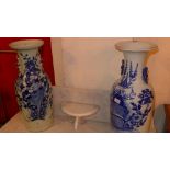 A pair of antique Chinese blue and white vases with floral decoration