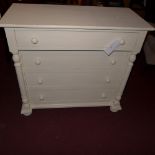 A white painted chest fitted four drawers flanked by columns