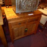 An Eastern hardwood chest fitted two drawers and pair of panel doors