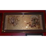 A Japanese embroided silkwork glazed and in gilt frame depicting demons