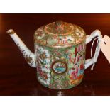 A C19th Chinese porcelain famille rose teapot decorated with many pictorial reserves