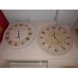 Two circular wall clocks with Roman numeral dials