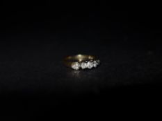 An 18ct gold and diamond ladies ring with heart decoration