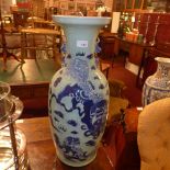 A pair of Chinese blue and white vases decorated with dragons
