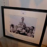 A framed print of a photograph of The Arsenal 1950 FA Cup Winning Team with Joe Mercer lifting The