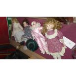 Four various porcelain dolls