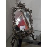 A Continental 900 silver framed Rococo design mirror (A/F)