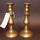 A pair of C19th brass candlesticks