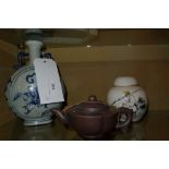 A Chinese terracotta tea pot together with a covered jar and a blue and white moon flask ( 3 )