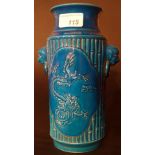 A Chinese blue glazed vase with dragons in relief