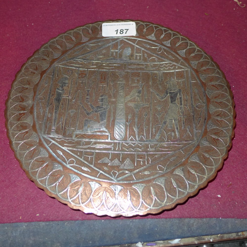 An Egyptian copper dish with silver inlay decorated in the traditional manner