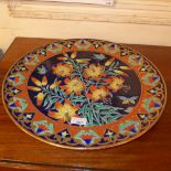 A French charger of large size decorated with flowers and butterflies