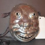 A 1950's South American silver face mask