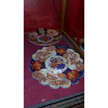 A C19th Imari pattern plate with flared rim and another Imari plate