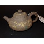 A Chinese earthenware tea pot