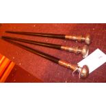 Three ebonised walking canes with silver plated mounts