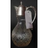A cut glass and silver plated claret jug