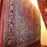 A fine North West Persian Sarouk rug 215 x 140 cm central pendant medallion on a terracotta field