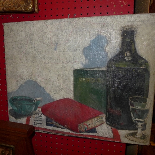 An oil on canvas cubist style still life bottle, novel and ashtray