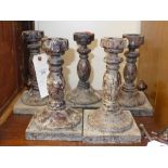 A set of five turned candlesticks