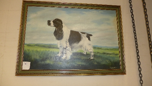 An oil on canvas portrait of a spaniel in gilded frame