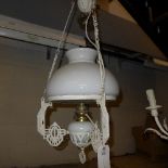 A white painted wrought iron gas lamp (converted) with opaque shade