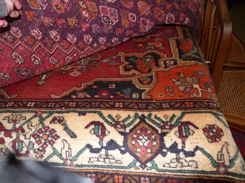 A fine North-West Persian Heriz carpet 350 cm x 170 cm central pole floral medallion disc on a