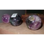 A set of three amethyst balls