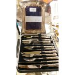 A sterling silver dressing mirror and silver handled pastry forks and knives