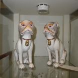 A pair of Chinese porcelain pugs probably C20th